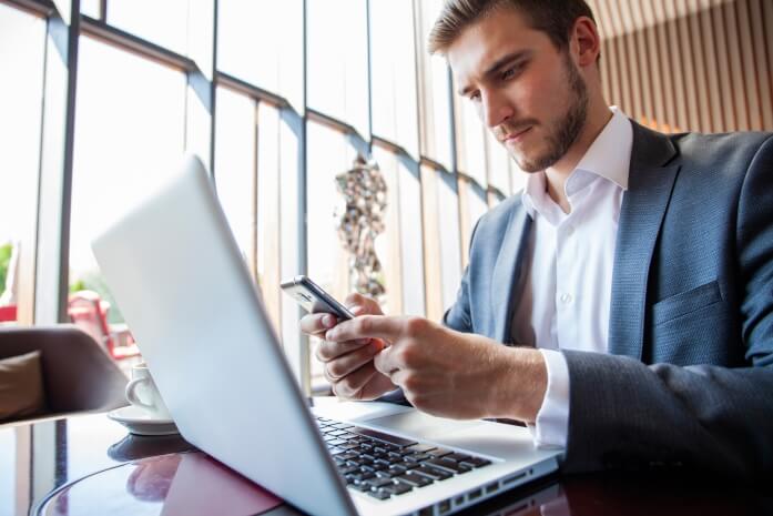 Businessman using his devices