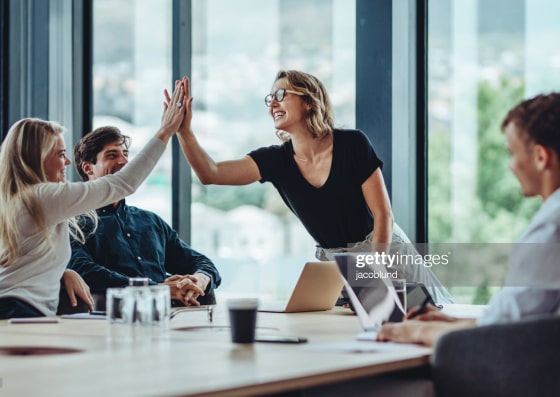 Smiling woman high-fiving