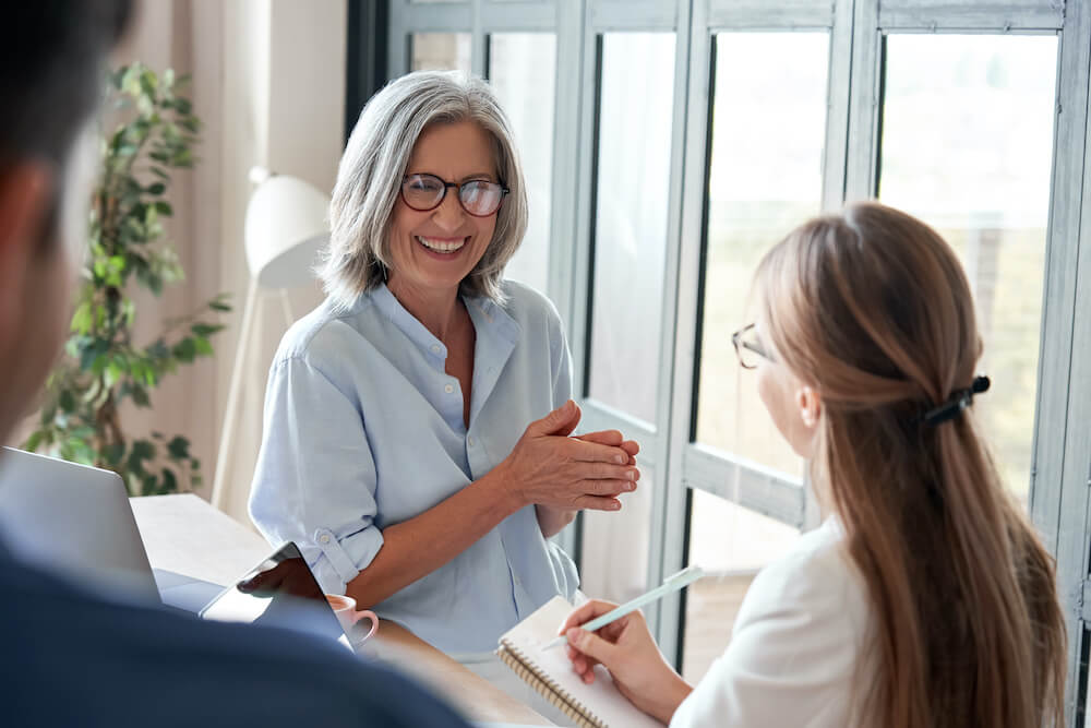 Woman and salespeople having a discussion